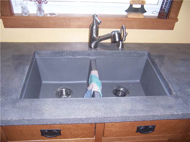 Concrete countertop with a composite undermount sink